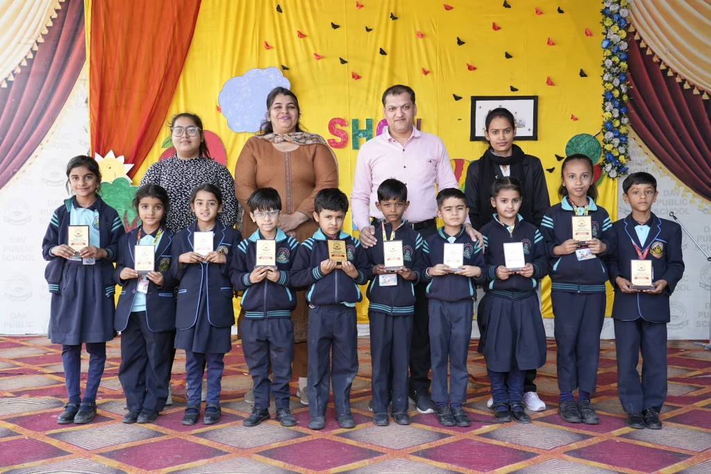 Best School in Suratgarh celebrating student achievement with awards and value-based education at DAV Public School