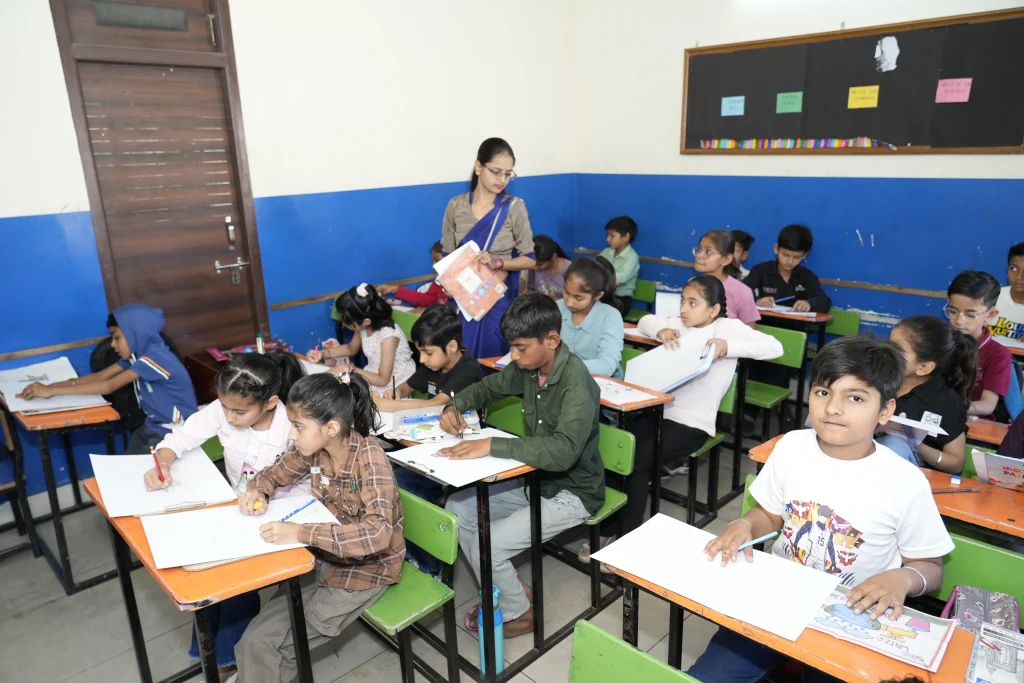 Best school in Suratgarh with experienced teachers guiding students in a classroom