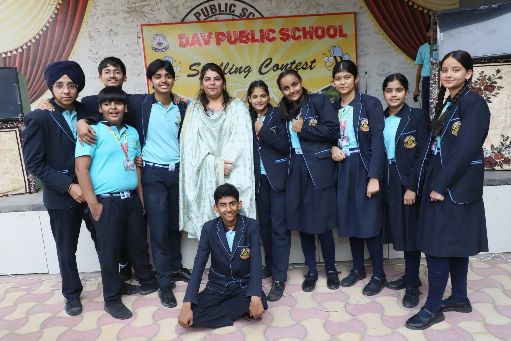 Students of D.A.V. Public School Suratgarh posing with teacher after Spelling Contest – Language skills nurtured at the Best School in Suratgarh